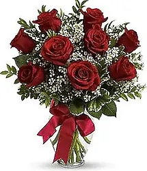 Bouquet of 9 large, premium Red Roses with seasonal decorative greenery. Ideal for any special occasion.