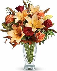 Roses, lilies and mixed flowers in warm colors